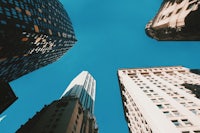 looking up at skyscrapers in a city