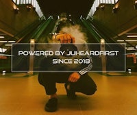 a man is smoking a cigarette with the words powered by juhadist since 2018