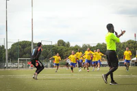 a group of people playing a game of frisbee