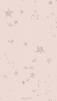 a pink background with white snowflakes on it