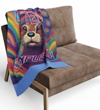 a blanket with an image of an otter on it