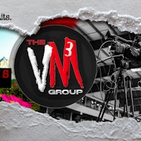 the vm group logo on a torn piece of paper