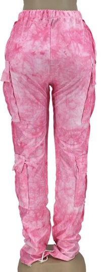 a pair of pink tie dye cargo pants on a mannequin