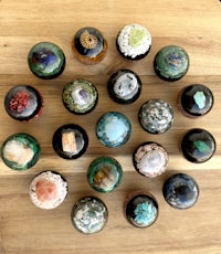 a group of different types of rocks arranged on a wooden table