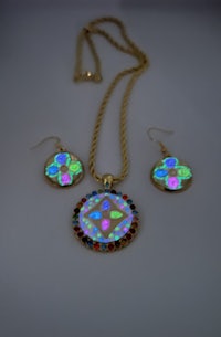 a necklace and earring set with colorful opals