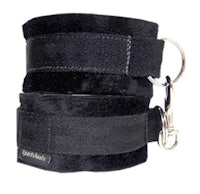 a pair of black leather cuffs with a key