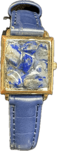 a blue and gold watch with a stone on it