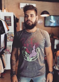 a man wearing a t - shirt in a shop