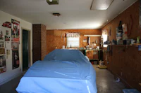 a blue tarp covering a car