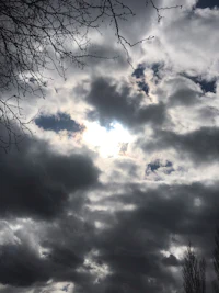 the sun is shining through a cloudy sky