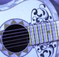 a close up of an acoustic guitar