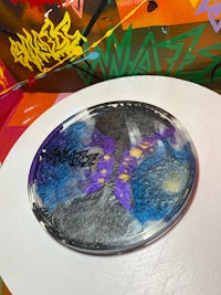 a plate with a purple and blue design on it