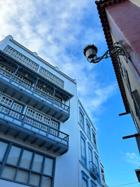 a building with balconies and a blue sky