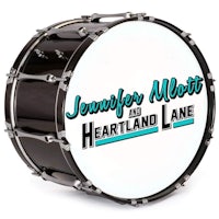 a drum with the word jennifer milton and heartland lane on it