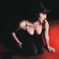 a woman is sitting on the floor