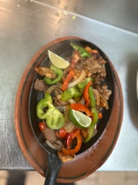 mexican food in a skillet on a table