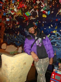 the man is wearing a purple jacket