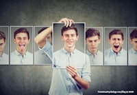 a man is holding up a picture of different facial expressions