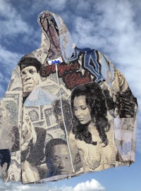 a hoodie with a lot of pictures on it