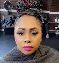 a woman with a braided hairstyle in a salon