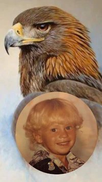 a photo of a young boy with an eagle in the background