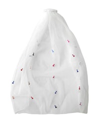 a white bag with colorful embroidery on it
