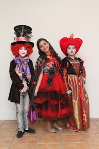 three children dressed up in costumes
