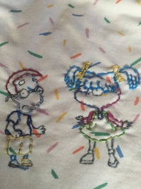 a drawing of a boy and a girl with confetti
