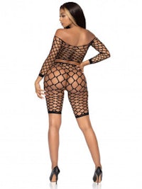 a woman in a black fishnet bodysuit