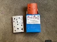 a box with a roll of toilet paper next to it