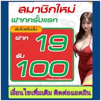 a woman in a red dress is posing in front of a sign
