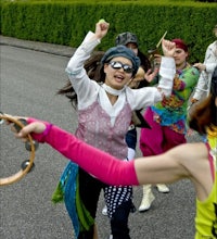 a group of people dancing with hula hoops