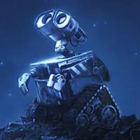 the wall - e robot is sitting on top of a rock