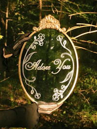 a person is holding up a mirror that says'advance you'