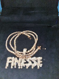 a necklace with a gold chain and a pendant