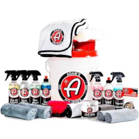 a bucket full of cleaning supplies and towels