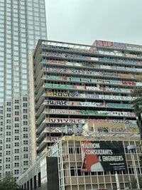 a tall building with a sign on it