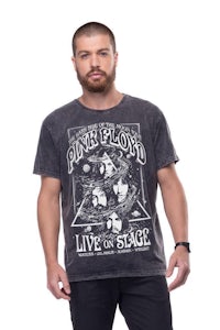 a man wearing a pink floyd t - shirt