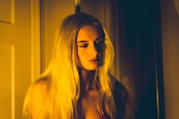 a woman in a red bikini standing in front of a mirror