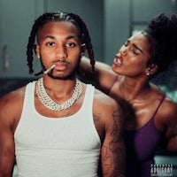 a man with dreadlocks and a woman with dreadlocks standing next to each other