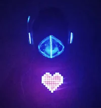 a person wearing a blue led mask with a heart on it