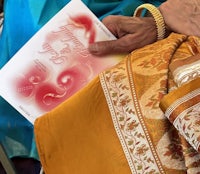 a woman is holding a book in her hands