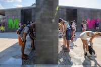 a group of people standing in front of a building