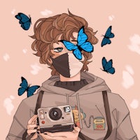a person holding a camera with butterflies on it