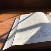 an open book on a wooden table