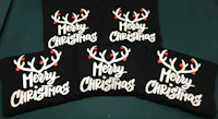 four reindeer hats with the word merry christmas on them
