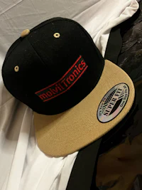 a white vest with a hood on a black background