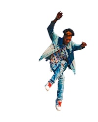 a man in a blue jacket is jumping in the air
