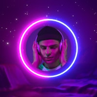a man wearing headphones in front of a neon circle