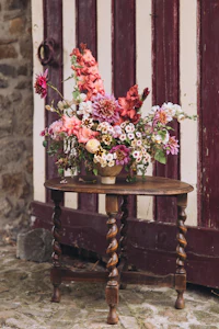 a wooden table with flowers on it